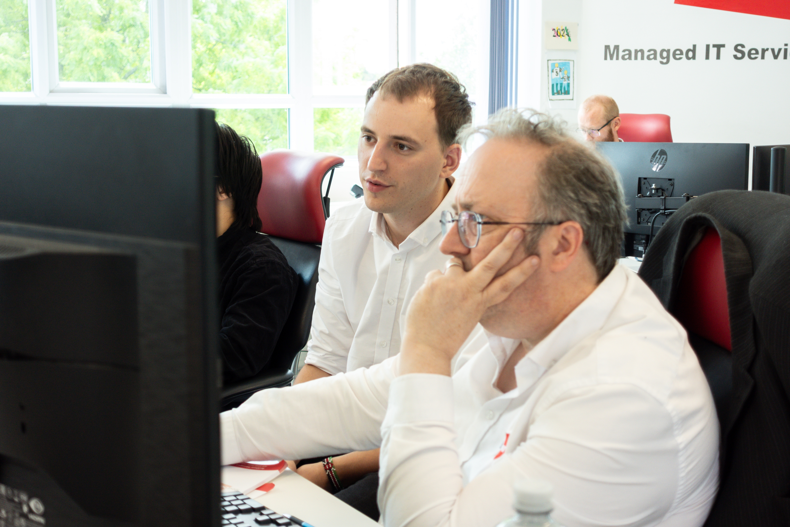 Simon and Matthew collaborating on a work project