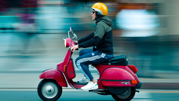 Microsoft 365 - man on moped getting to destination